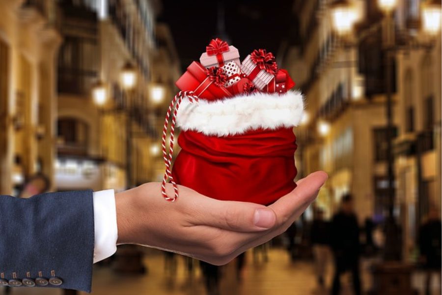 Christmas Movie Distributors: Hand with bag