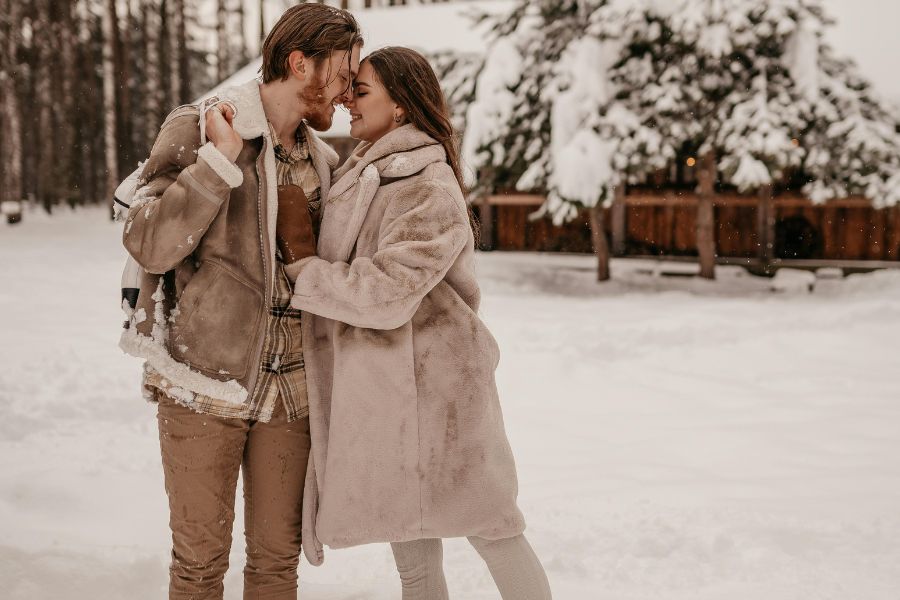 Couple kiss in snow: 10 Must-Know Tips for Writing Christmas TV-Movies