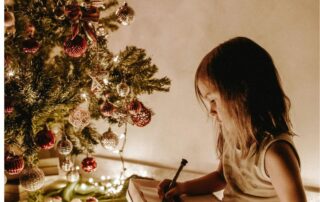 Girl by tree: Sell your Christmas movie blog
