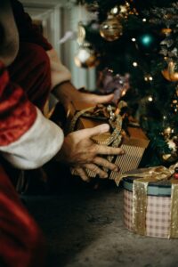 Santa places gift under tree: Sell Your Christmas movie blog